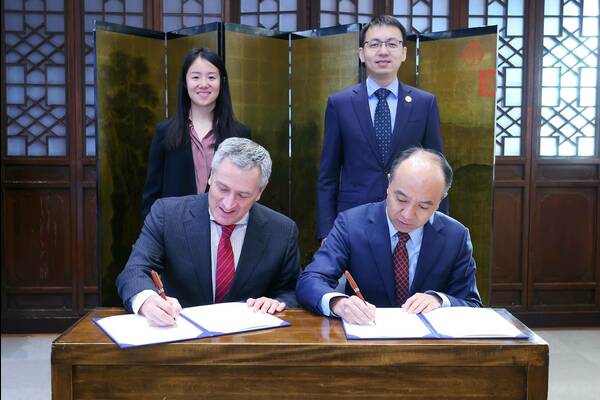 Michael Pippenger and Hongwei Wang sign student exchange agreement