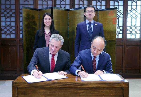 Michael Pippenger and Hongwei Wang sign student exchange agreement